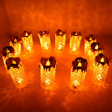 Collection of gold flameless LED tea light candles with a crystal-like appearance, suitable for gifting.