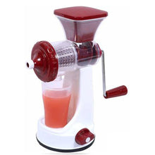 Manual fruit juicer with juice cup and waste collector