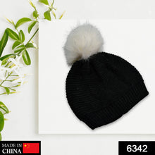 Winter woolen beanie cap with black fur lining.